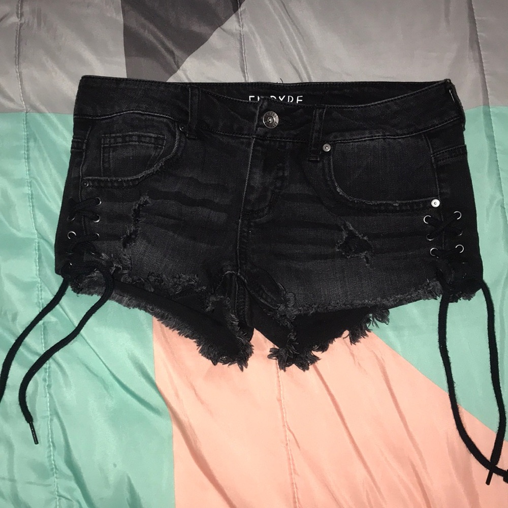 black jean shorts.